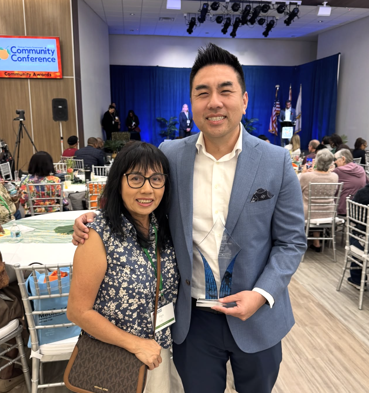 Ricky Ly with his mother at the Community Conference